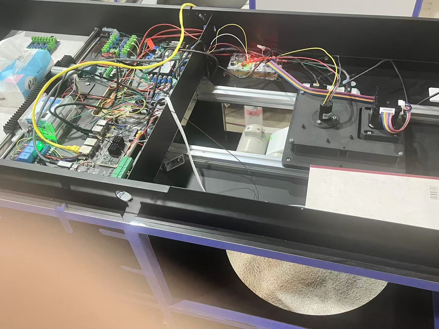 Prototype internals showing RK3576 main board, arm controller, and motor wiring